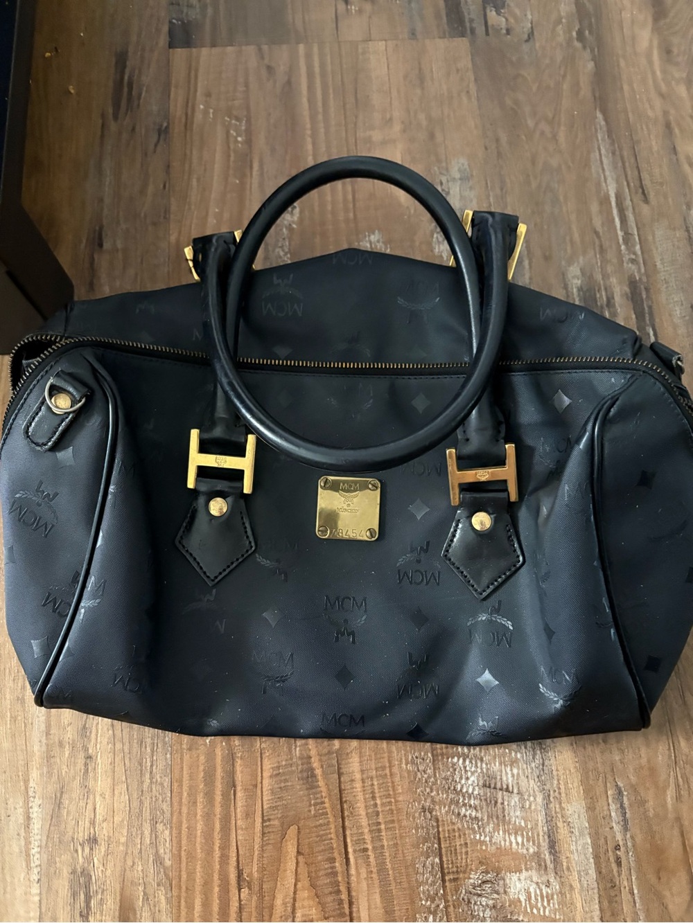 MCM Black Logo-Embossed Leather Satchel with Gold Hardware